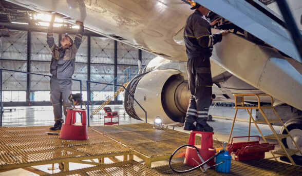 engineer-working-on-aircraft-wing-in-aircraft-main-LNUHJLN (1)